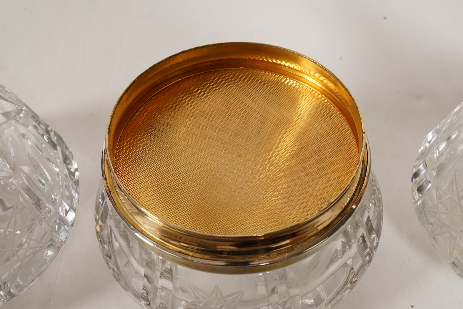 A mid 20th century continental eight piece gilt white metal and tortoiseshell mounted dressing table set